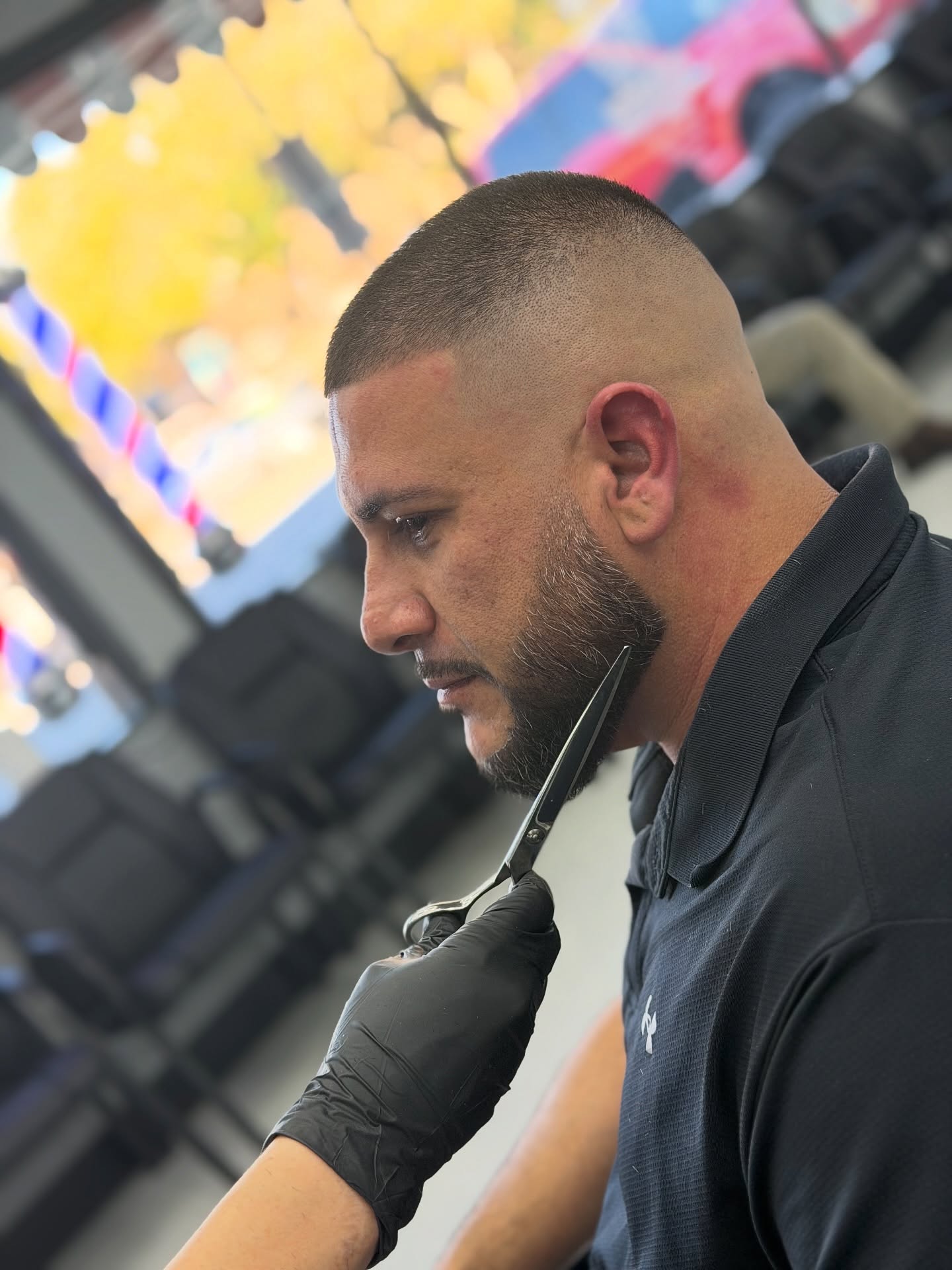 Skin fade with beard line by Hailey